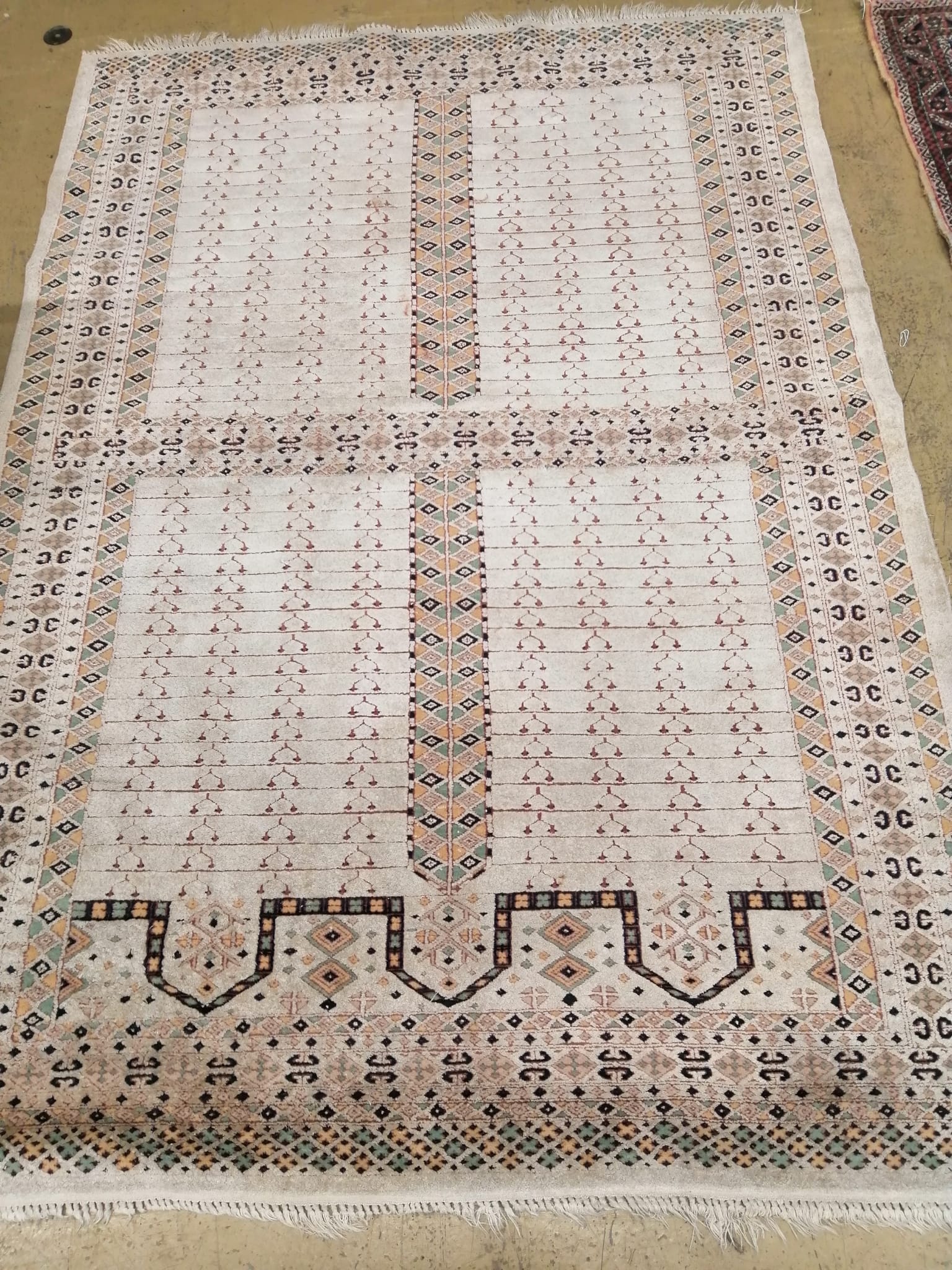 An ivory ground rug, 180 x 128cm